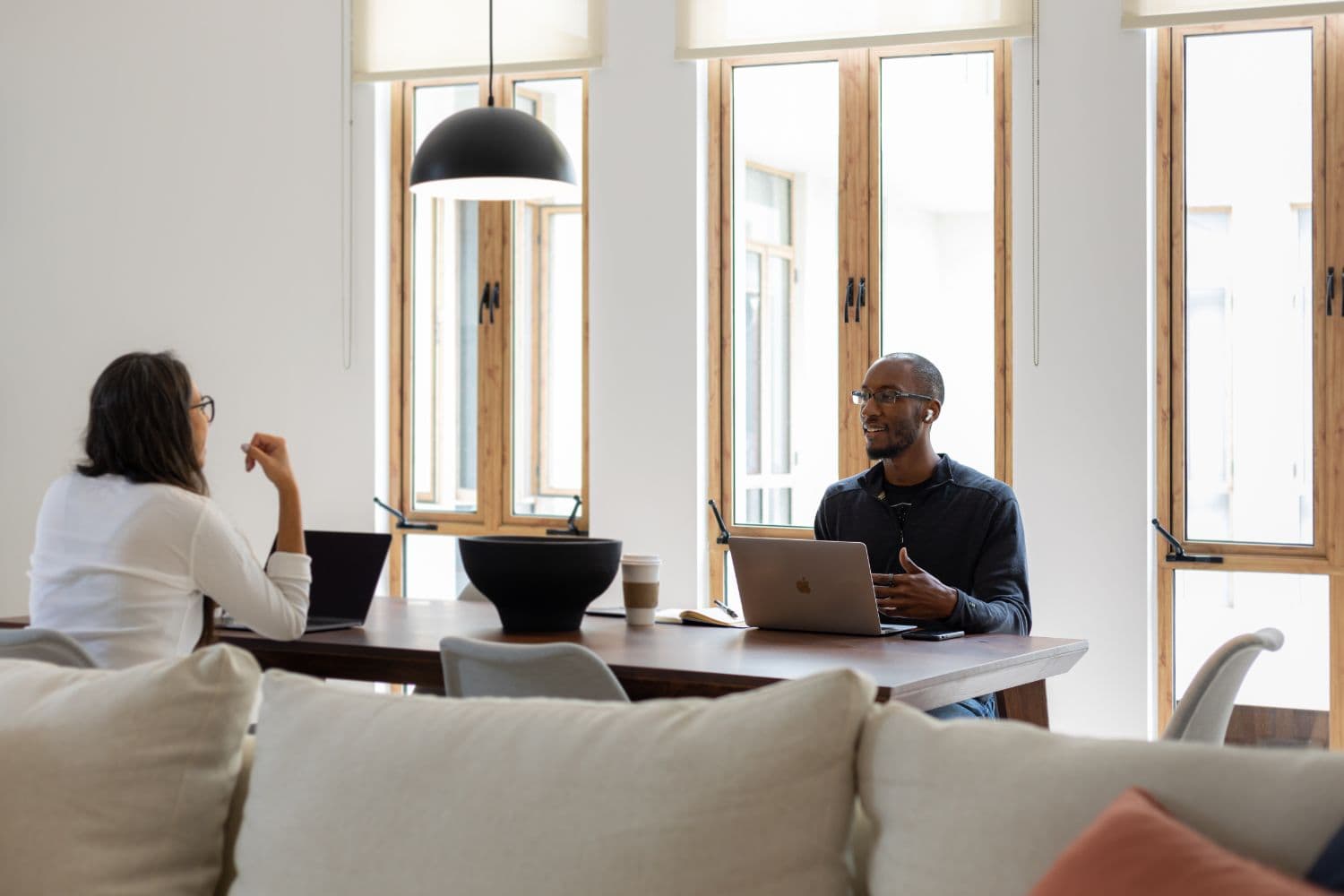 Digital nomads collaborating in a cozy coliving space
